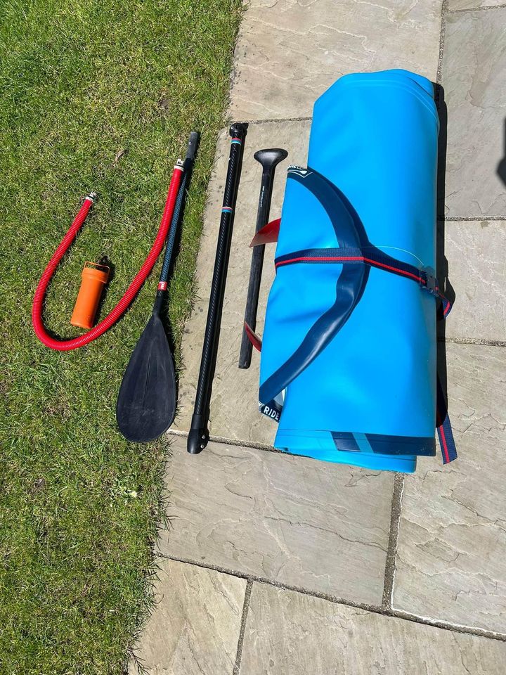 Red Paddle Co 10’6 Ride Inflatable Stand Up Paddle Board Package, Blue